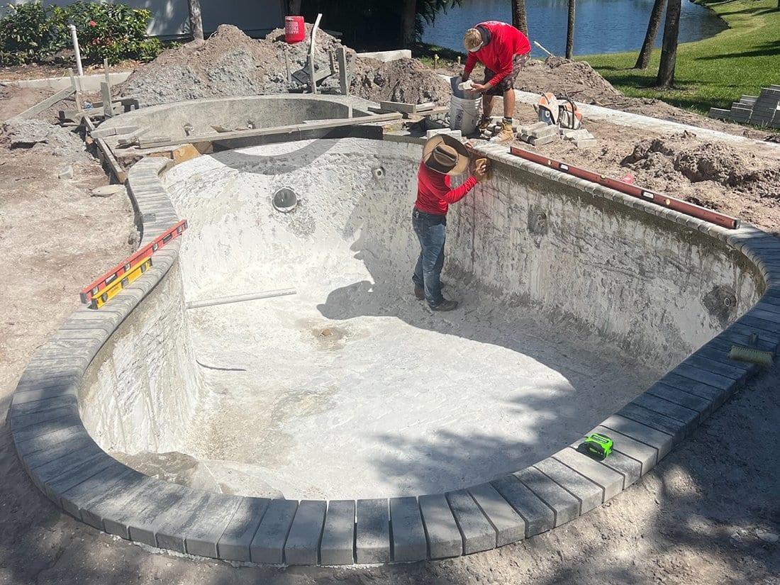 Paver Mac crew rebuilding a pool deck