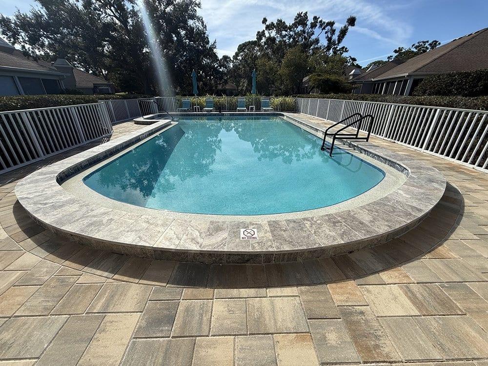 After: Cracked concrete to paver pool deck
